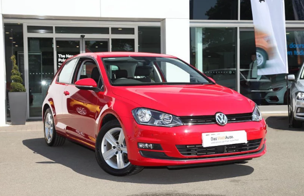Red Golf for sale on a dealership forecourt